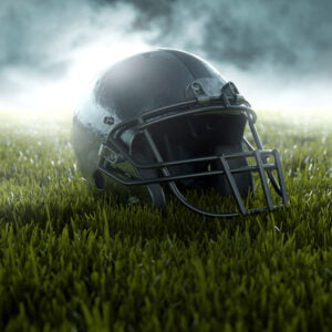 A helmet kept on grass with cinematic filter