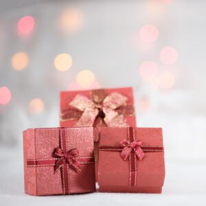 Closeup of three red box gifts for people with hearing loss.